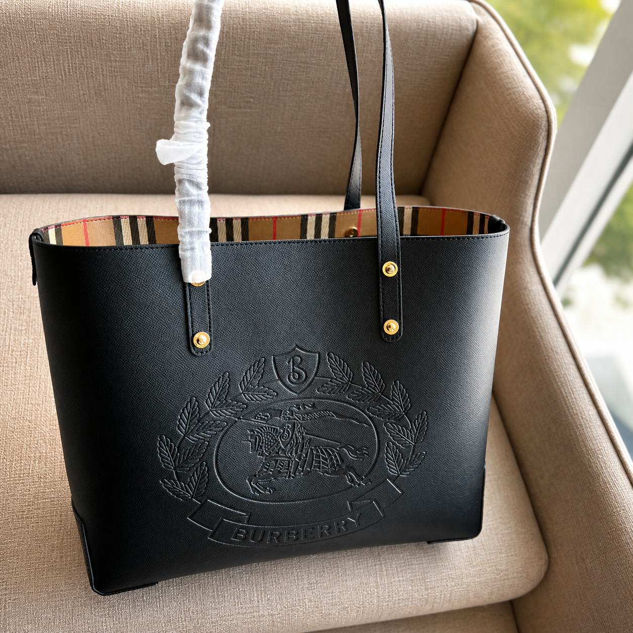 Burberry Embossed Logo Crest Leather Tote Bag