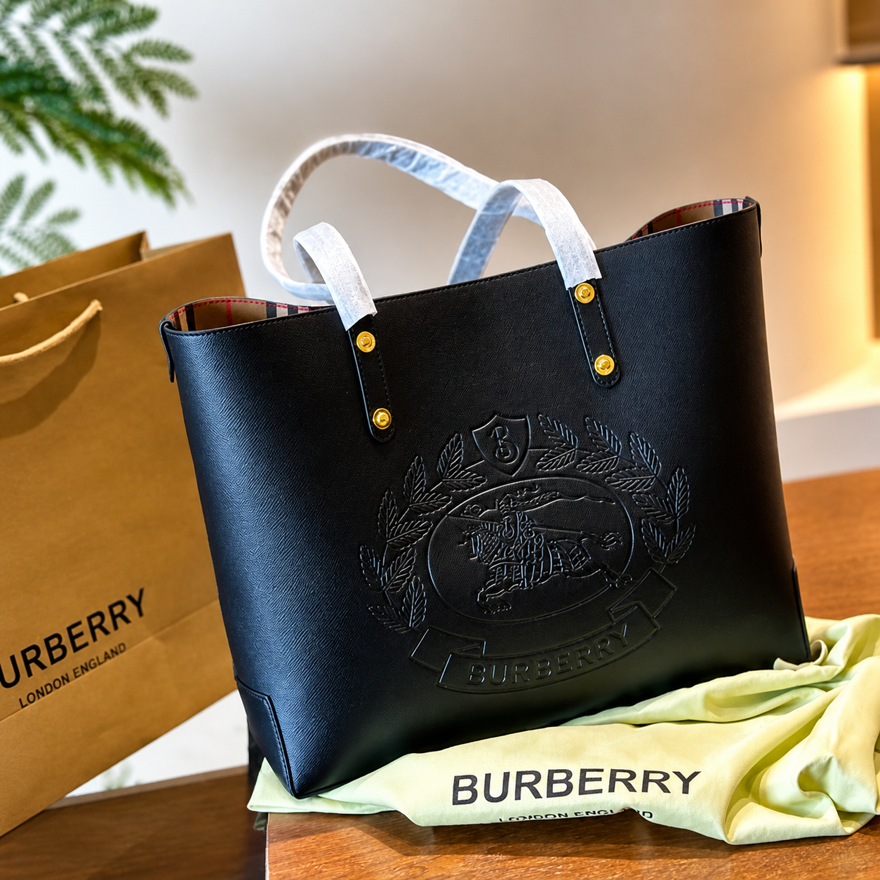 Burberry Embossed Logo Crest Leather Tote Bag