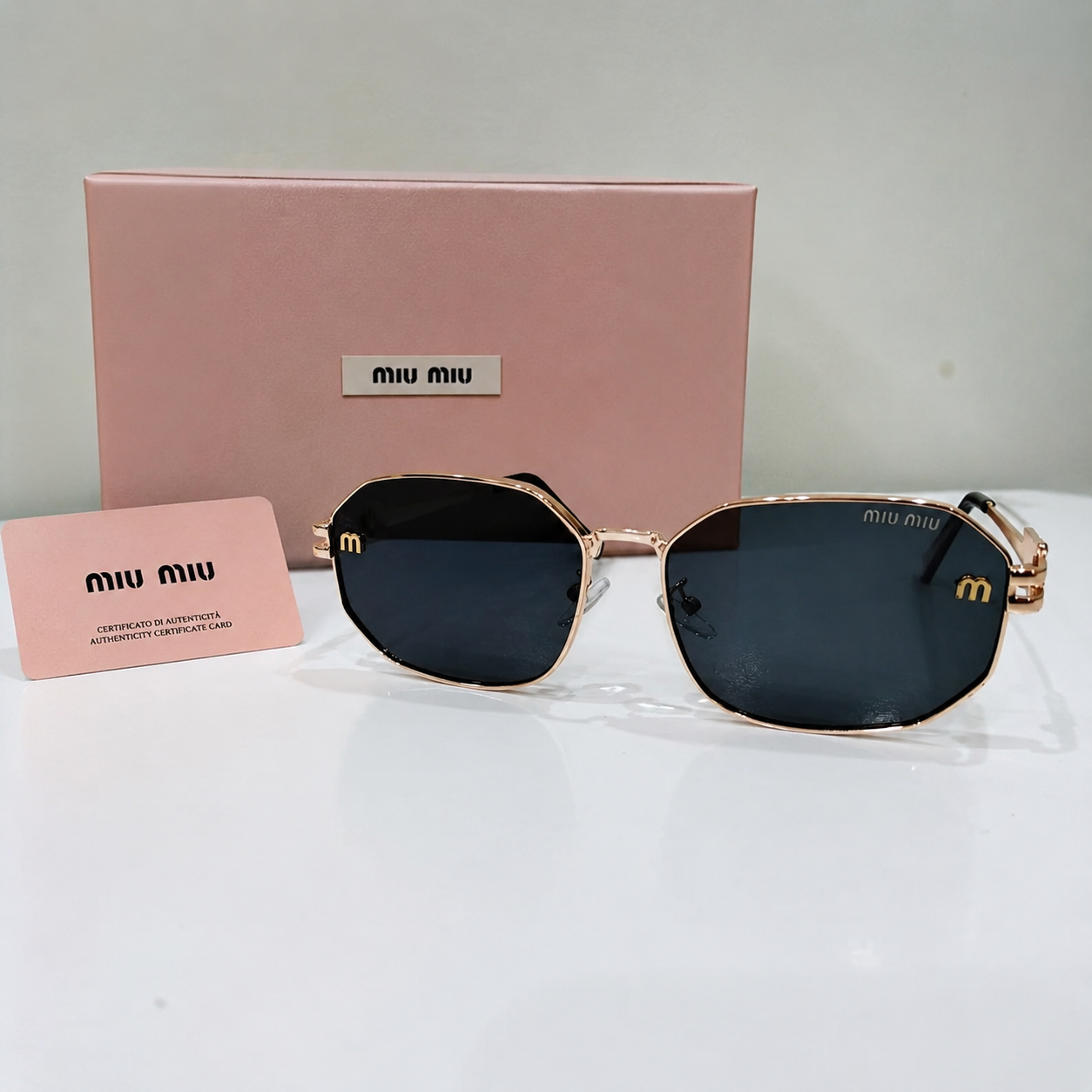 Miu Miu Gold Geometric Logo Sunglasses