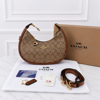 Coach Signature Monogram Crescent Shoulder Bag