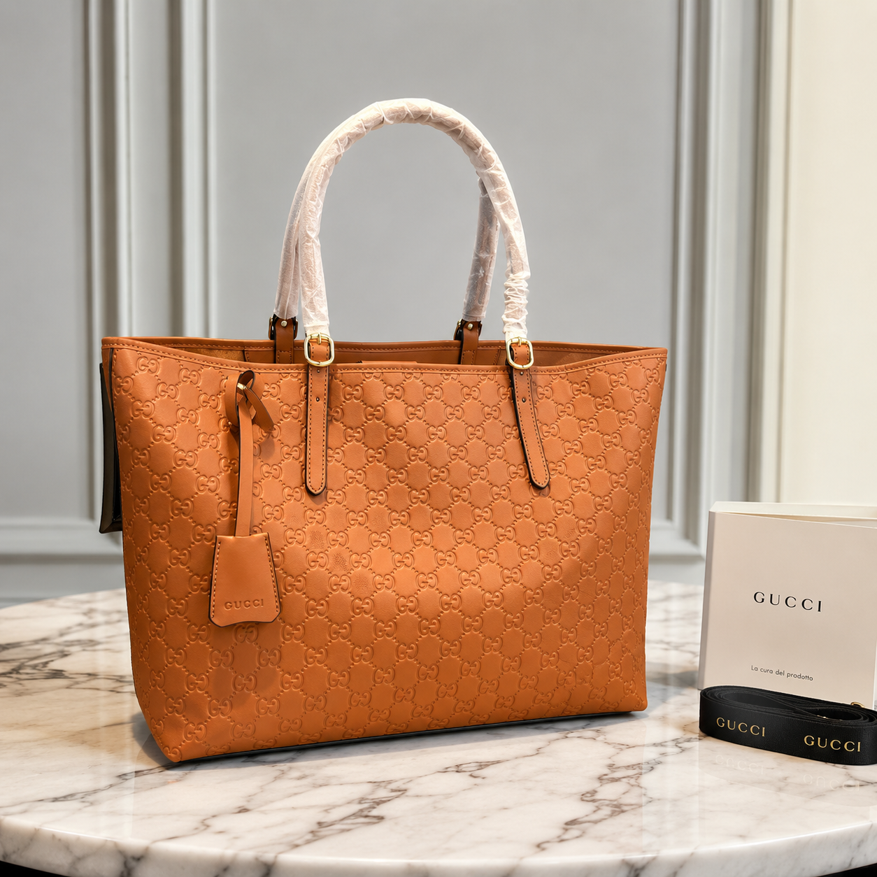 Gucci GG Emblem Debossed Leather Tote Bag