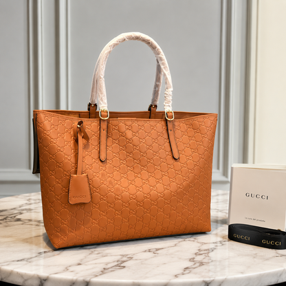 Gucci GG Emblem Debossed Leather Tote Bag