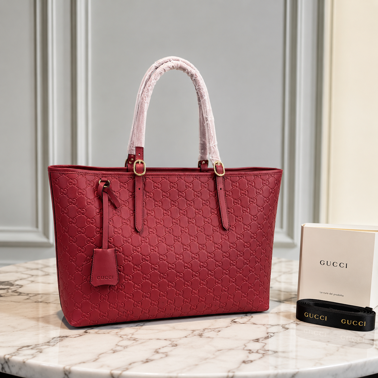 Gucci GG Emblem Debossed Leather Tote Bag