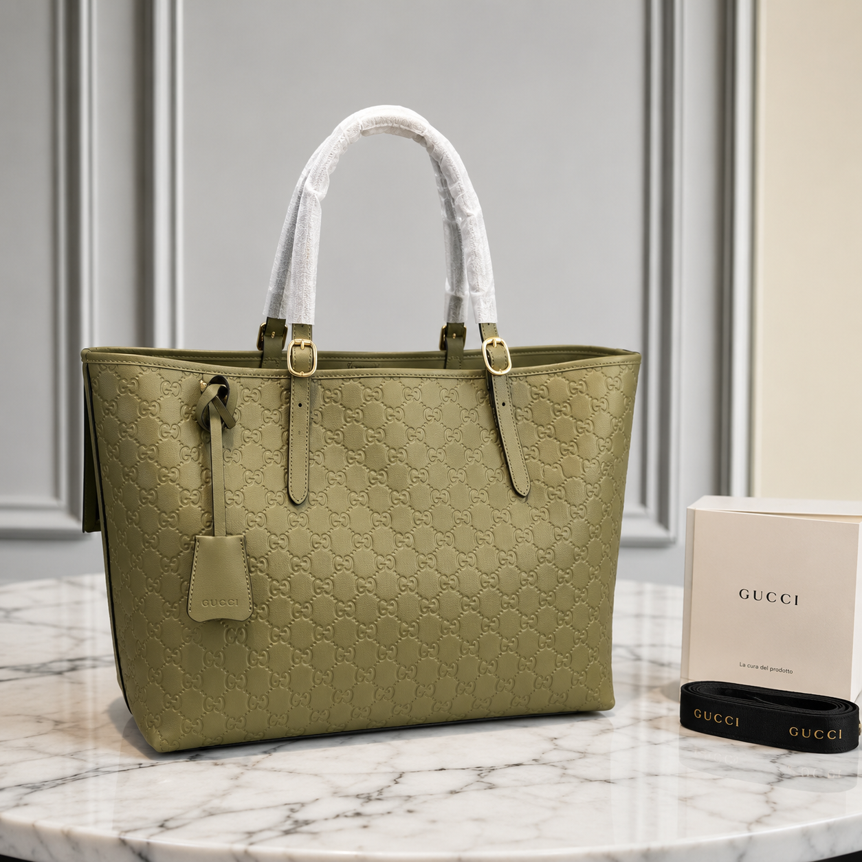 Gucci GG Emblem Debossed Leather Tote Bag