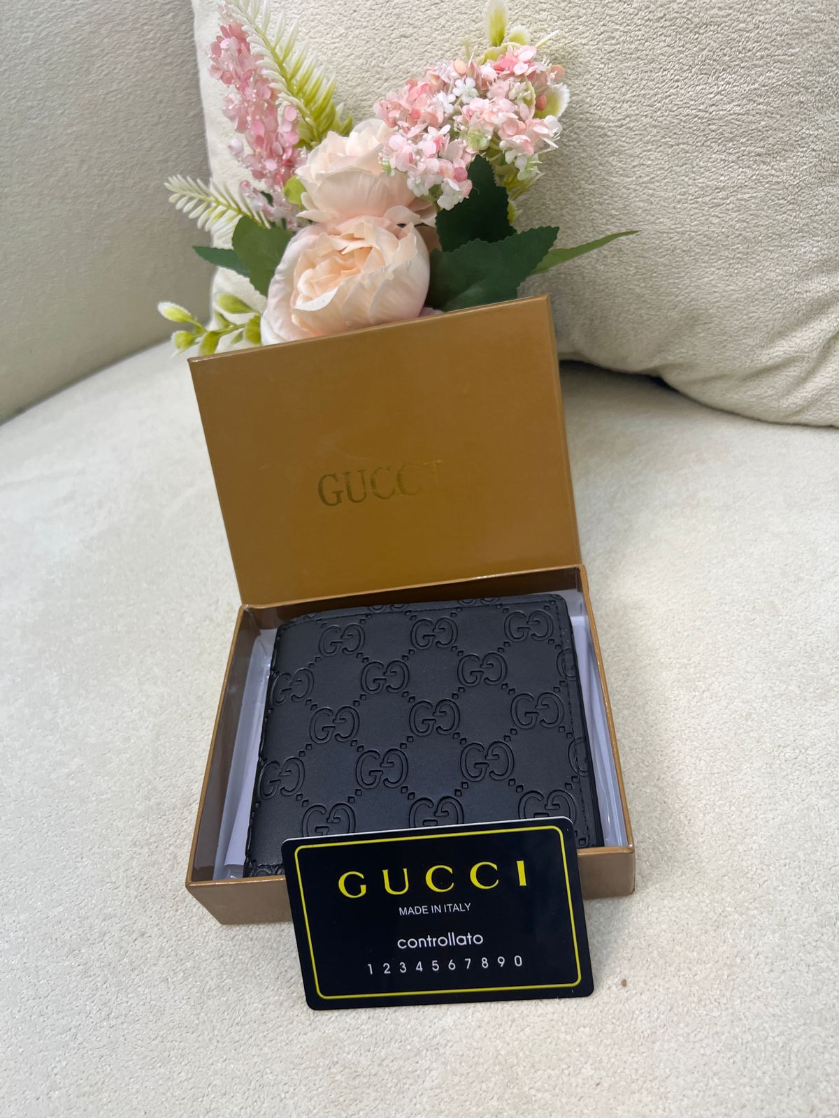 Gu-cci GG Embossed Leather Bi-Fold Wallet Style