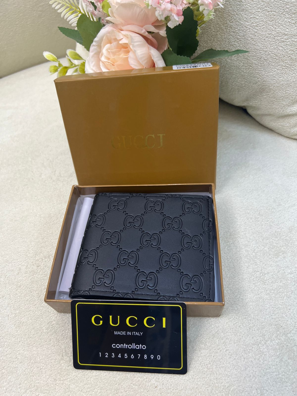 Gu-cci GG Embossed Leather Bi-Fold Wallet Style