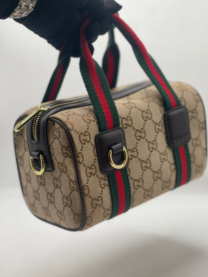 Gu-cci Mini GG Handbag (GG Supreme Canvas – Web Stripe)