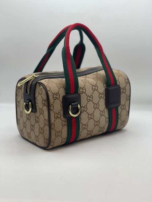 Gu-cci Mini GG Handbag (GG Supreme Canvas – Web Stripe)