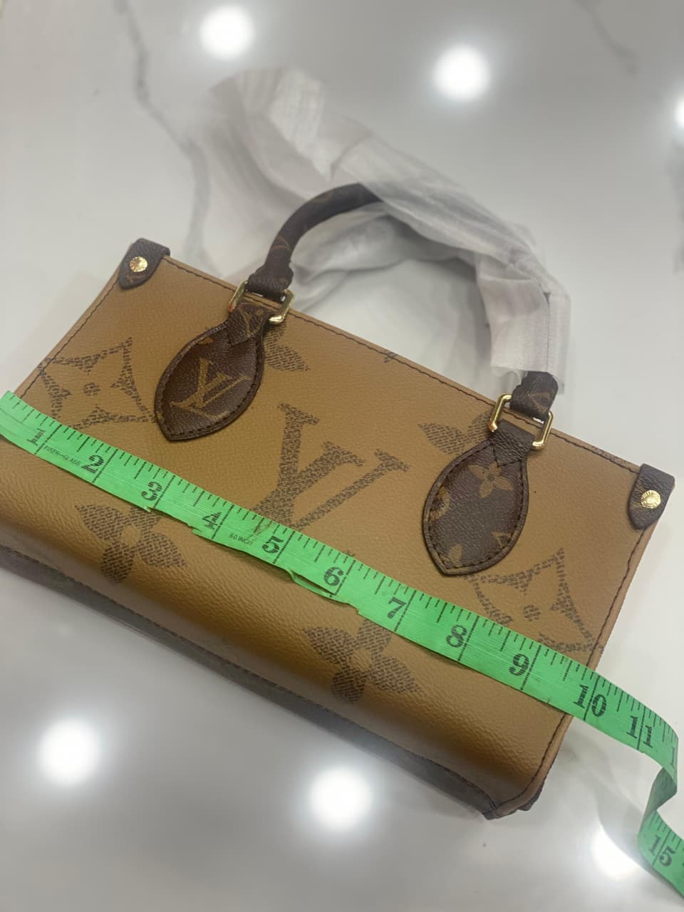 Louis Vuitton OnTheGo East West Chain Monogram Reverse Canvas