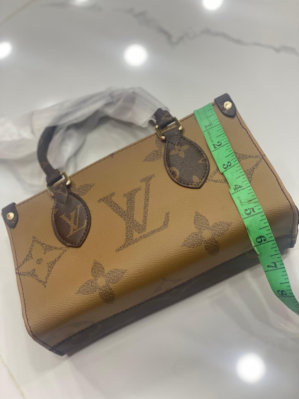 Louis Vuitton OnTheGo East West Chain Monogram Reverse Canvas