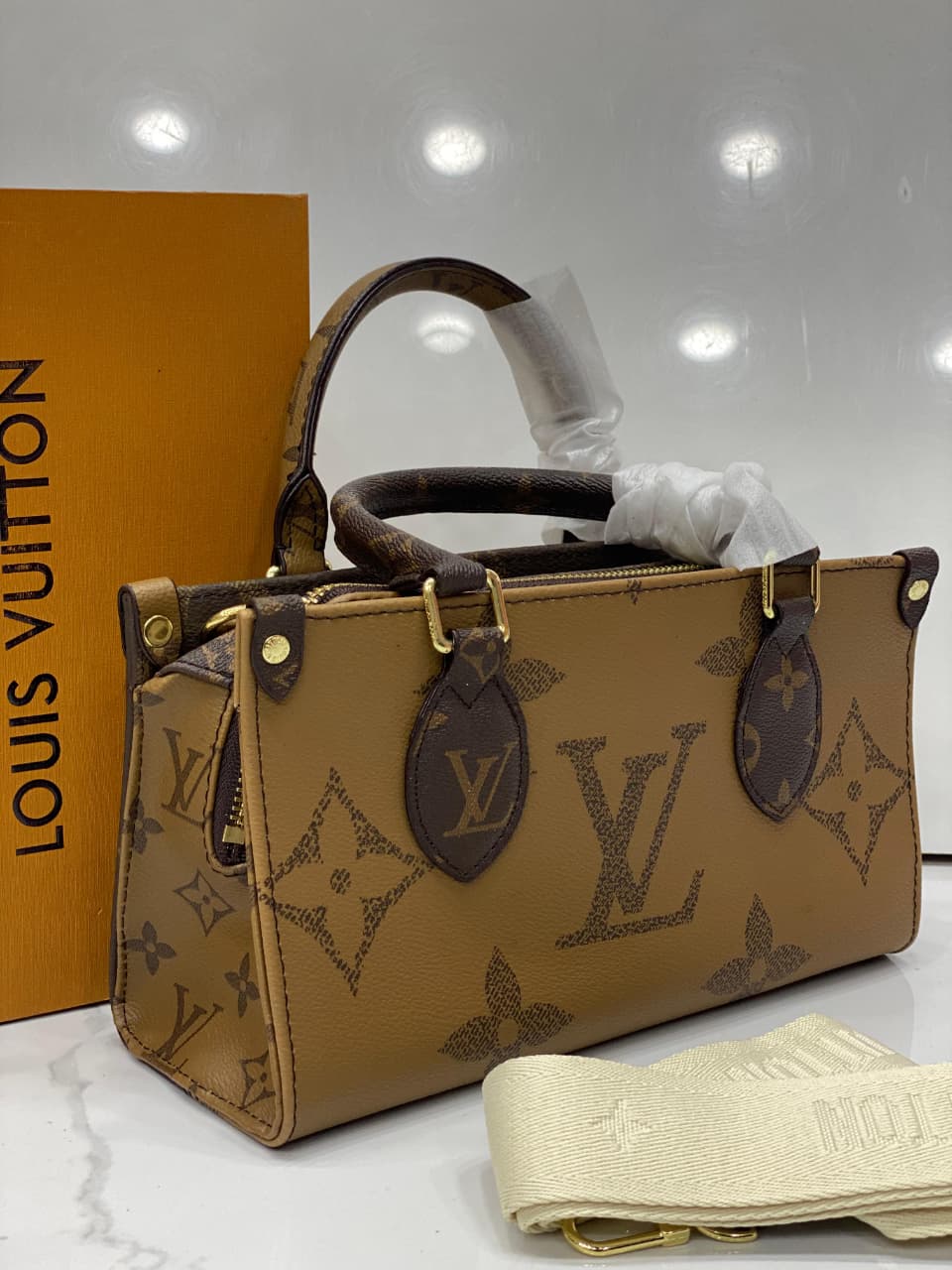 Louis Vuitton OnTheGo East West Chain Monogram Reverse Canvas