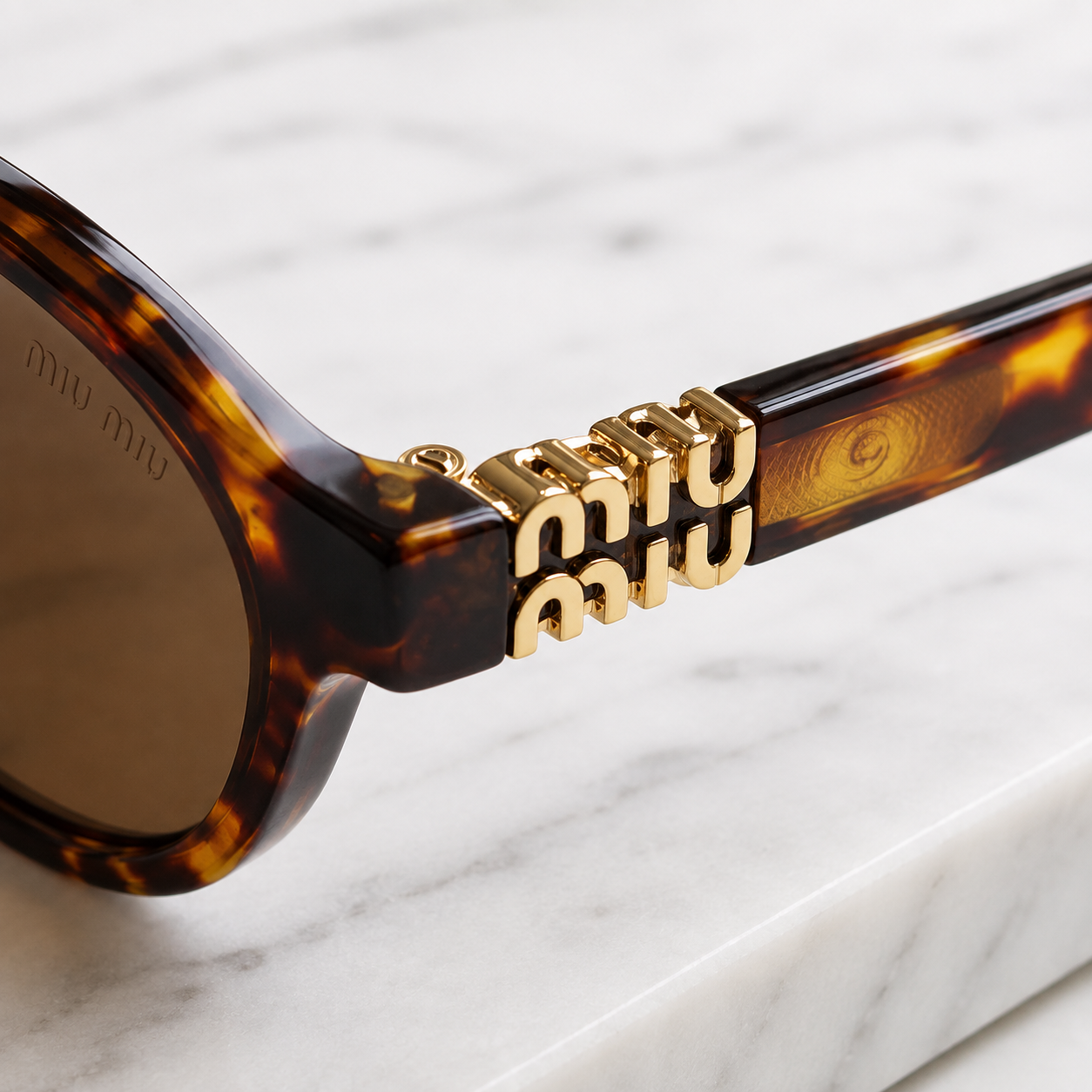 Miu Miu Classic Oval Sunglasses